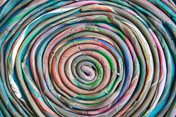 Abstract colorful plasticine spiral made by kids in the school. Toy and play backgrounds