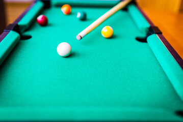Billiard snooker balls composition on the green pool table. Gambling game of Billiards.