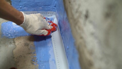 Waterproofing damper tape in the bathroom. - obrazy, fototapety, plakaty