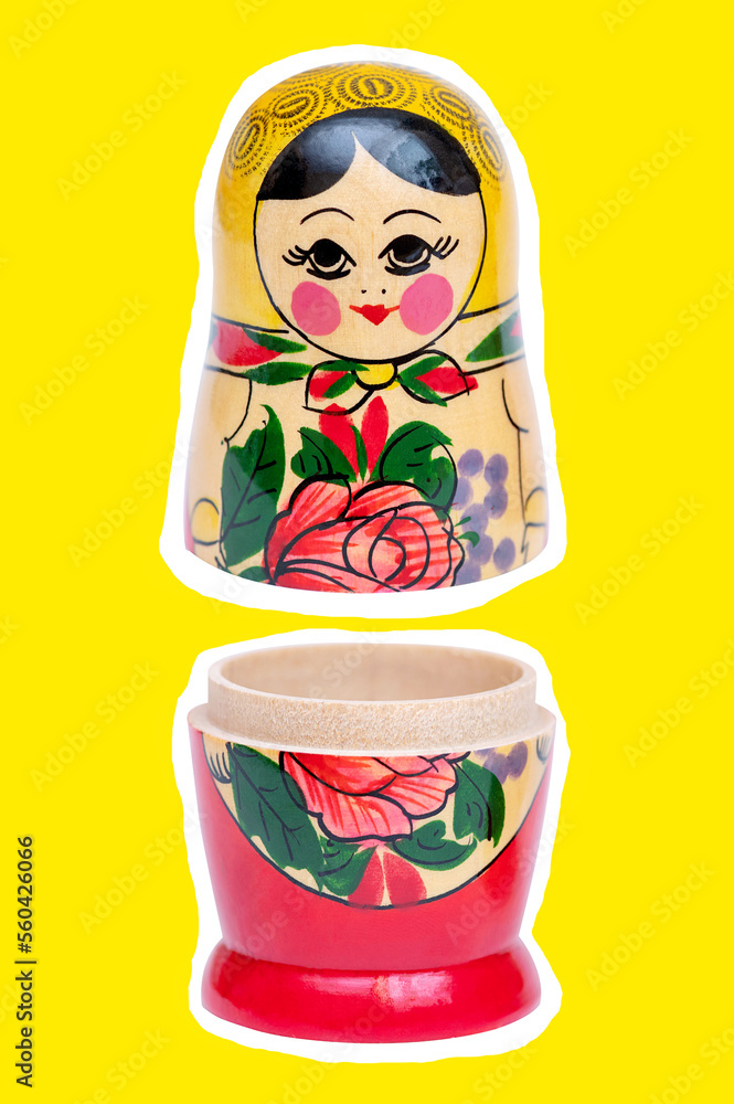 Wall mural Matryoshka traditional russian doll open on yellow background