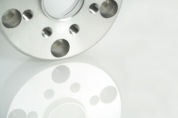 Aluminum suspension parts on white background,space for text,High precision steel automotive parts manufacturing by innovative CNC machining