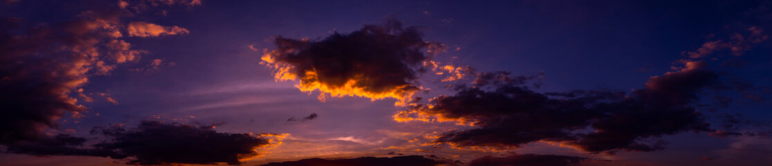 Panorama Beautiful sunset - sunrise with dark clouds. Sky with clouds. Colorful natural background