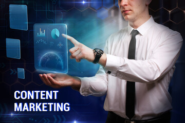 Business, Technology, Internet and network concept. Young businessman working on a virtual screen of the future and sees the inscription: Content marketing