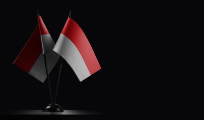 Small national flags of the Indonesia on a black background