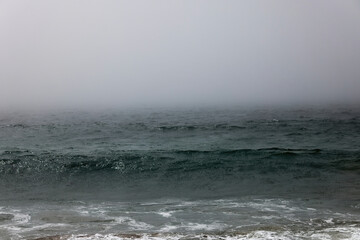 Ocean waves in a morning mist