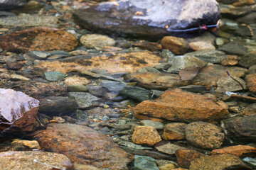 Stones under clear water