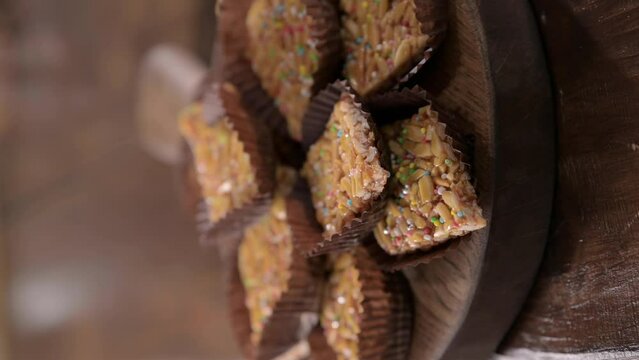 Desserts with almonds, peanuts and seeds in caramel. Traditional Sardinian sweet. Sweet squares. High quality 4k footage. Almond Gateau, sarda Food, for smartphones and social networks