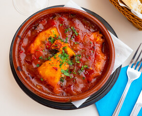 Traditional catalan dish cod with samfaina, fillet of white fish with vegetable ratatouille in...
