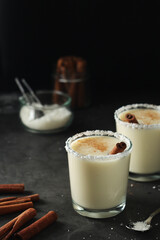 Two glasses with traditional Puerto Rico cocktail Coquito	