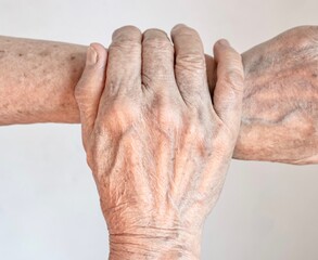 Aging hands of Asian elder woman. Concept of rheumatoid arthritis , osteoarthritis, wrist strain or...
