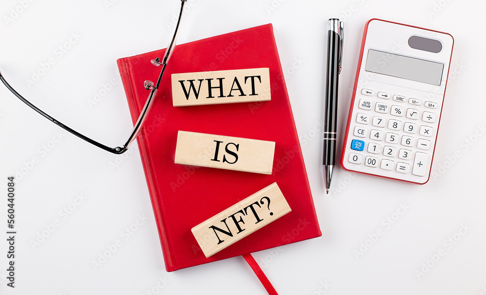 Poster what is nft text on wooden block on red notebook