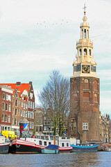 Amsterdam, Montelbaanstoren Tower facing Ouderschans canal, Netherlands