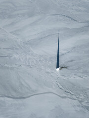 Aerial apocalyptic scene, church tower with cross buried under mud and toxic copper mining residuals. Geamana, Romania