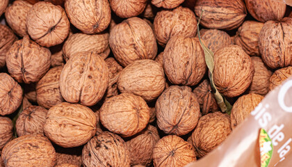top view, of a box of ripe, local and freshly picked, walnuts, packed in a wood box