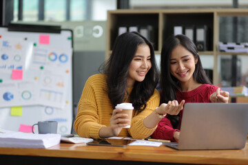 Happy businesswomen colleagues discussing in the office, Planning collaboration and participation of people in the organization.