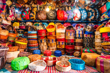 Variety of leather poufs sold in huge shop next to tannery in Fes, Morocco, Africa