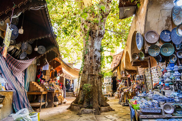Green courtyard with shops with traditional Moroccan products in Fes,  Africa