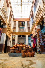 Shop in the courtyard with traditional tajine pot in the middle, Fes, Morocco, Africa