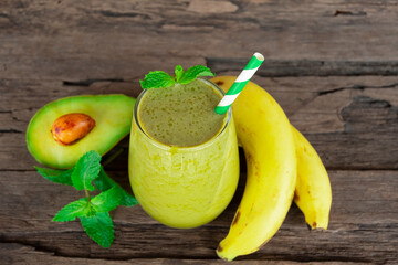  Avocado and Banana fresh cocktail smoothies fruit juice beverage healthy the taste yummy in glass drink episode good morning on wooden background. 