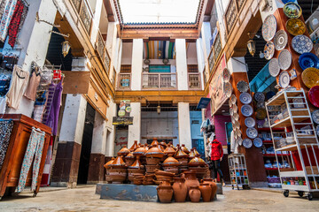 Shop in the courtyard with traditional tajine pot in the middle, Fes, Morocco, Africa