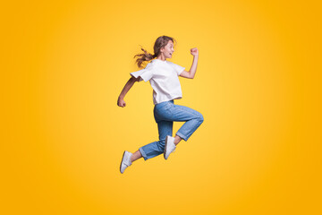 Full body young smiling happy woman hurry up isolated on yellow color background studio portrait. People lifestyle concept