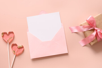Valentine's card with blank for love letter and pink envelope, gift, pink lollipops as heart on...