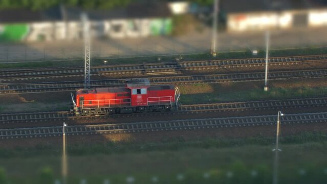Aerial of Electric Locomotive Engine on Multiple Tracks Railway Tilt-Shift