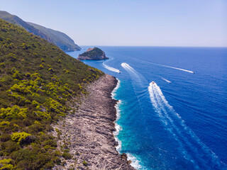 Drone shot of Zakynthos island with beautiful turquoise Ionian sea and limestone cliffs near famous Navagio beach during daytime - 560449006