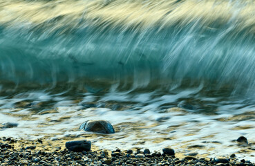 Abstract background of sea water with stones