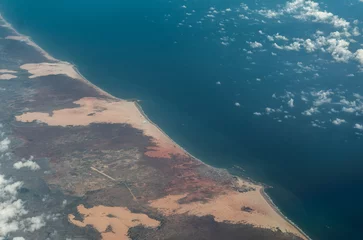 Rolgordijnen Aerial landscape view of Somalian coastline around the City of Baraawe , the Capital of the South West State of Somalia in the Lower Shebelle region located at Indian Ocean with Baraawe Airport © Mario Hagen