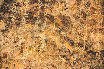 Ancient inscriptions on a stone in the Tamgaly tas tract on the Ili River in the Almaty region.