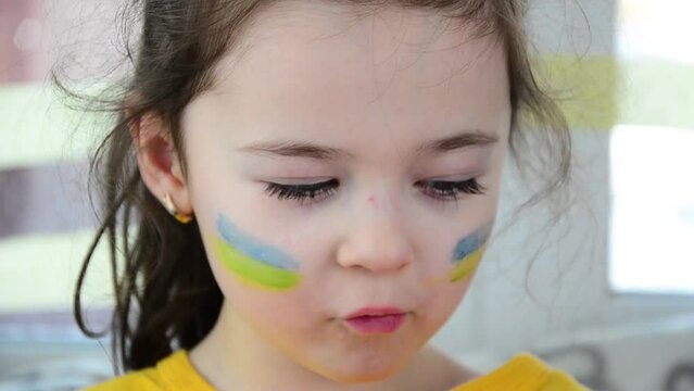 Ukrainian child during the war. War in Ukraine. Child in tears during the war. Stop war. Peace concept. The shelling of Ukrainian cities. Russian aggression in Ukraine. Winter in Ukraine. Rocket strik