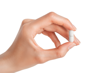 Hand holding white pill isolated on white or transparent background. Pharmacy, pharmacology, medicine.