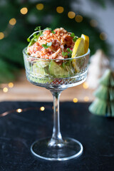 Crayfish cocktail with lettuce and bacon crumbs in the glass