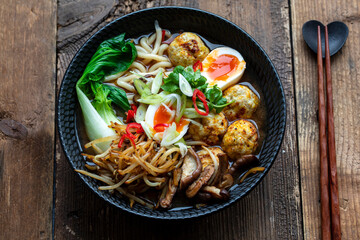 Ramen soup with meatballs and udon noodles