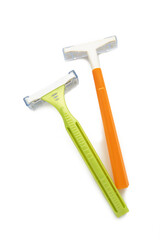 Green and orange woman razor isolated on a white background.