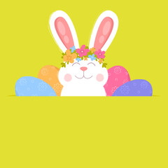 Cute Easter bunny with flowers on his head and colorful eggs