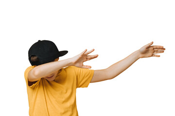 Young boy dressed in yellow t-shirt and black baseball cap over transparent background makes teenagers dab gesture, moves his hands aside, covering his face, that means i did it. Youth culture concept