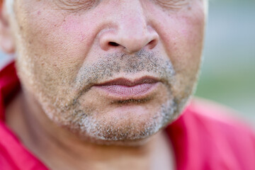 Evil incredulous face of a Russian man of about 60.