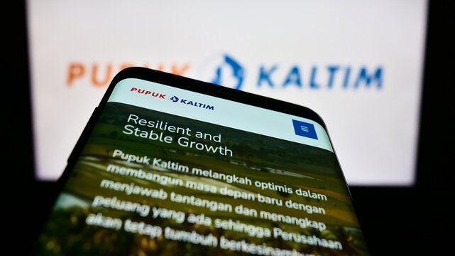 Stuttgart, Germany - 01-06-2023: Smartphone with website of Indonesian company PT Pupuk Kalimantan Timur on screen in front of business logo. Focus on top-left of phone display.