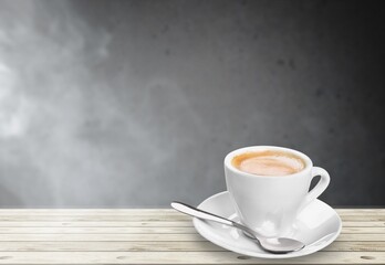 Tasty hot coffee in cup on the table