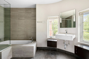 Styled Home Still Lifestyle Image. Contemporary White and Gray Half Bathroom. Black Floating Vanities and Glass Enclosed Soaking Tub. Warm Gray Bath Tile.