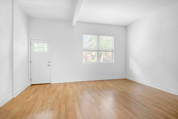 Empty Renovated Living Room for Virtual Staging. White Walls and Ceiling with Wooden Floors.
