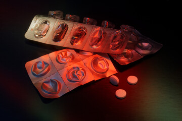 Two empty blister pack with pills, illuminated with red color