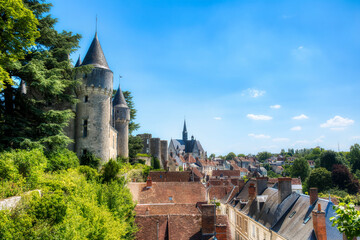 View of the Beautiful Village of Montresor, Loire, France, with St John the Baptist Collegiate Church and Towers of Montresor Castle - obrazy, fototapety, plakaty