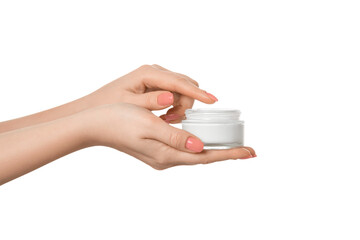 Thick hand cream on a woman's palm, 2nd hand finger takes a drop of cream. Groomed hands, pink nail polish.