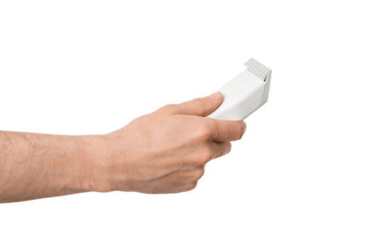 White trimmer for cutting hair and beard in a male hand, isolate on a white background.
