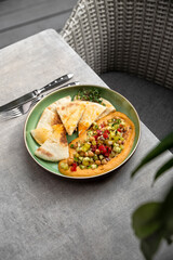 Hummus plate with pita bread. Middle Eastern traditional appetiser.