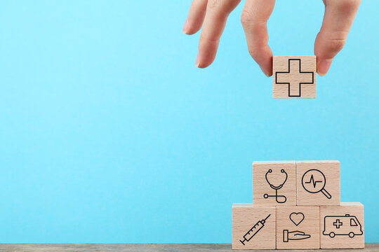 Concept image of public health system, Medicine Hospital Background, Step by step, Hand holding wood cube, blue copy space