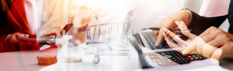 Businessman and team analyzing financial statement Finance task. with smart phone and laptop and...